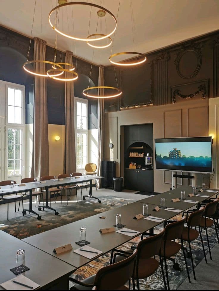 An elegant hotel conference room set for delegates